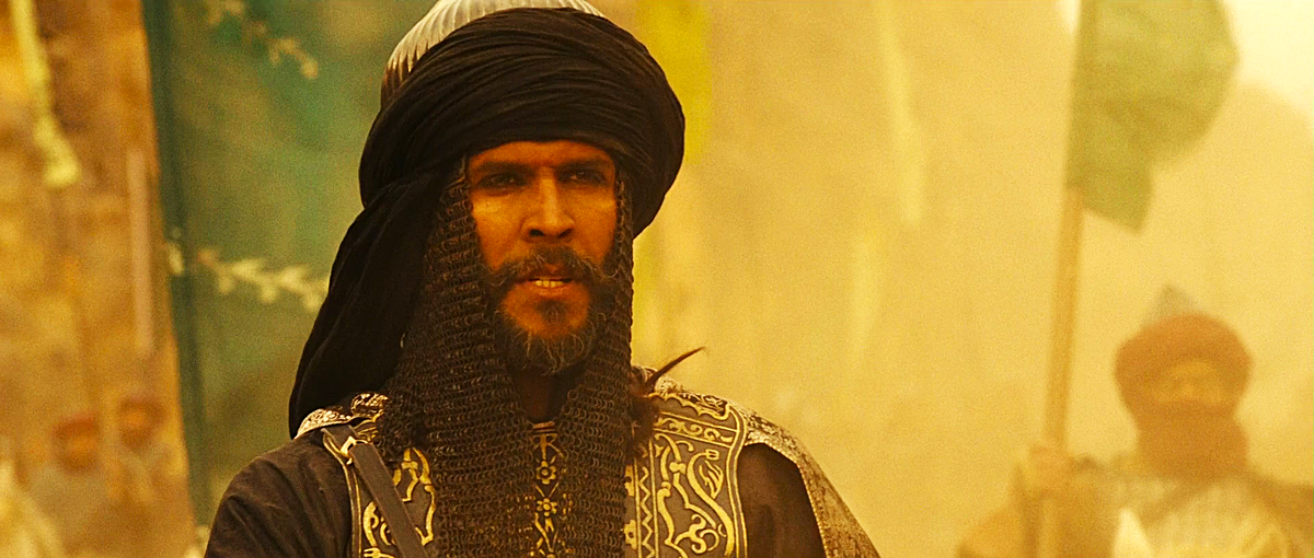 Киновоплощение образа Салах ад-Дина. Здесь и далее по тексту кадры из фильма-дилогии «Арн: Рыцарь-тамплиер» и «Арн: королевство в конце пути) (2007 и 2008 годы; производство – Швеция, Дания, Норвегия, Финляндия, Марокко и Великобритания. Автор сценария – Ханс Гуннарссон. Режиссёр – Питер Флинт). В роли султана Саладина – индийский актёр Милинд Соман