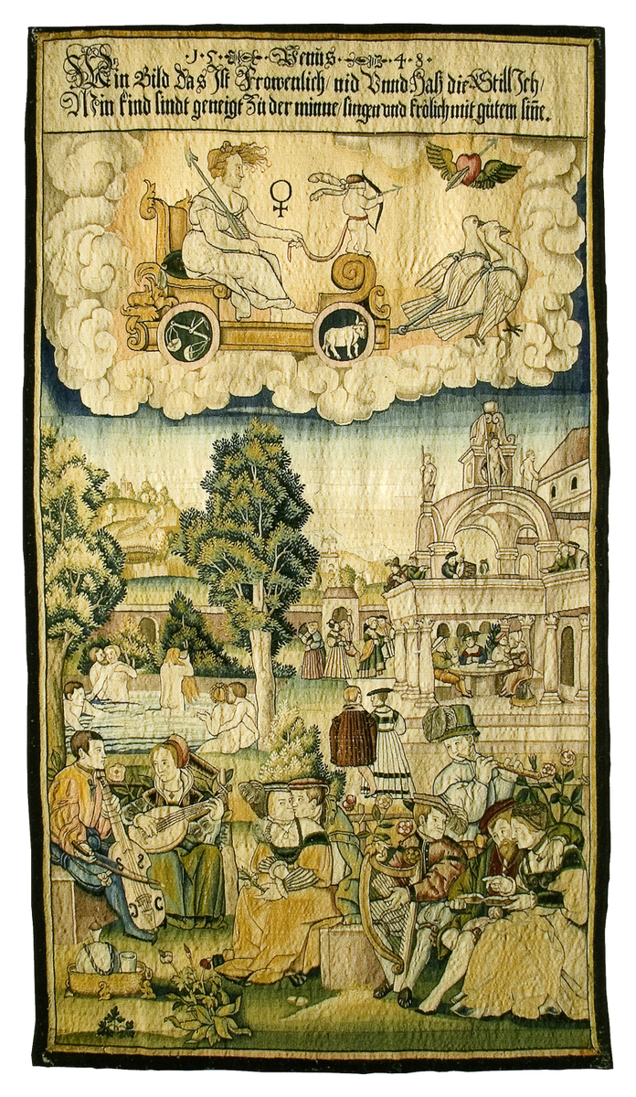 Шпалера «Венера и ее дети» из серии «Семь планет и их дети». 1549 г. По картону Георга Пенца (1500–1550). Германия, Нойбург-на-Дунае. В верхней части композиции изображена Венера (Афродита, "пенорождённая") и её сын Купидон (Амур) на повозке запряженной голубями (птицами, известными своим нежным отношением друг к другу), колеса которой украшены подчинёнными им знаками зодиака (в данном случае это Телец и Весы).