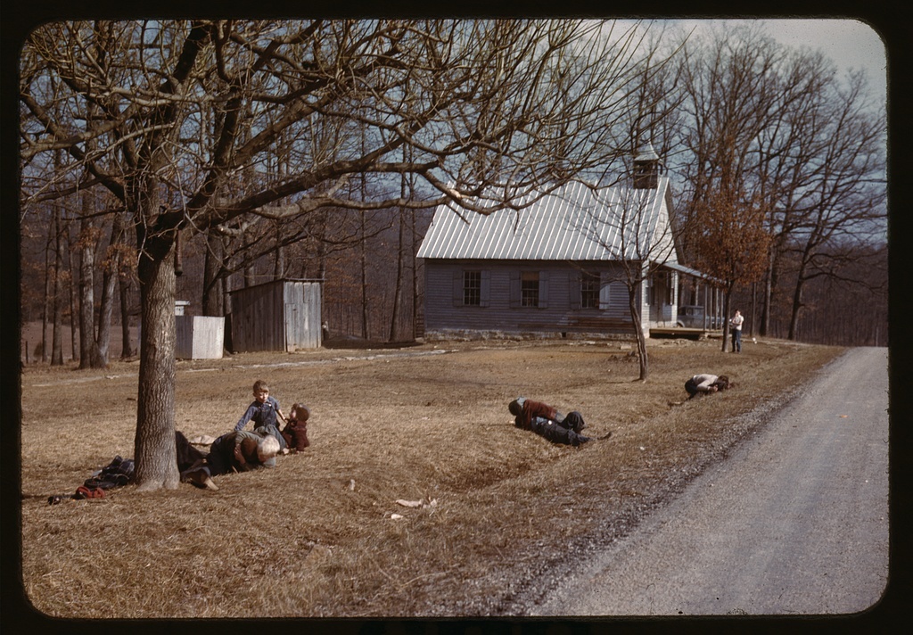 https://commons.m.wikimedia.org/wiki/File:Children_playing_by_road_near_school_house,_Kansas1a34287v.jpg