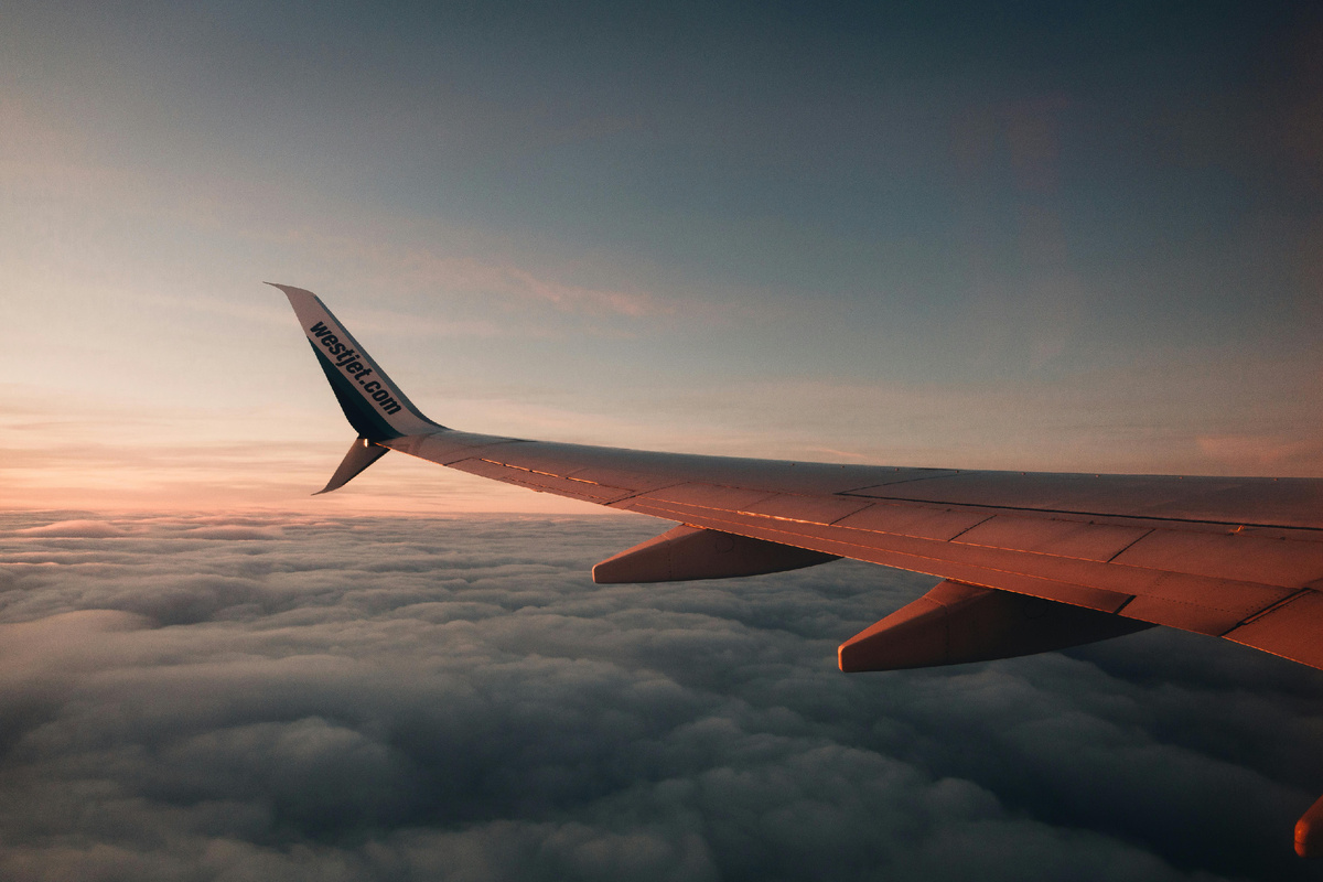 Photo by ConfinedRiley: https://www.pexels.com/photo/an-airplane-wing-above-thick-clouds-11278700/