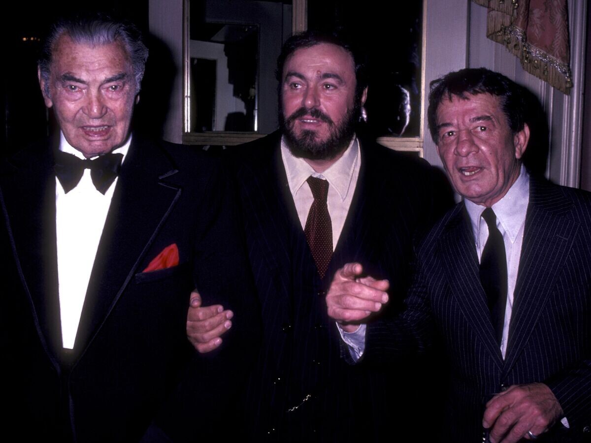 © Getty Images / Ron Galella📷Спортсмены Джек Демпси и Рокки Грациано и певец Лучано Паваротти