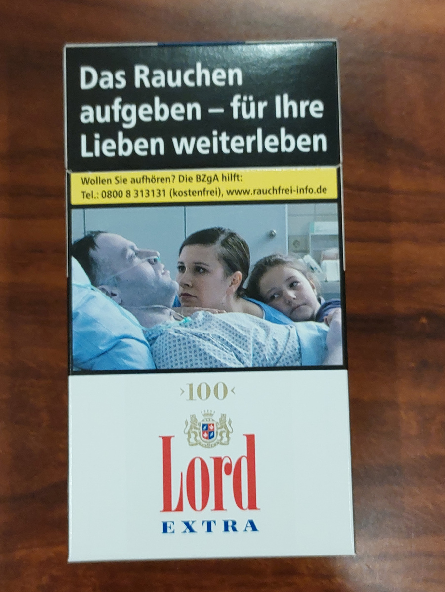 Сотка Lord Extra с картинкой и надписью о вреде курения 