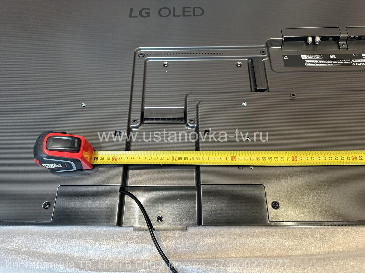 Размеры кабель-канала телевизора LG OLED G5 65": начало от левого края – 656 мм, конец – 784 мм.