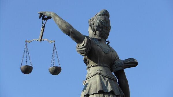    CC BY-SA 2.0 / Michael Coghlan / Scales of Justice