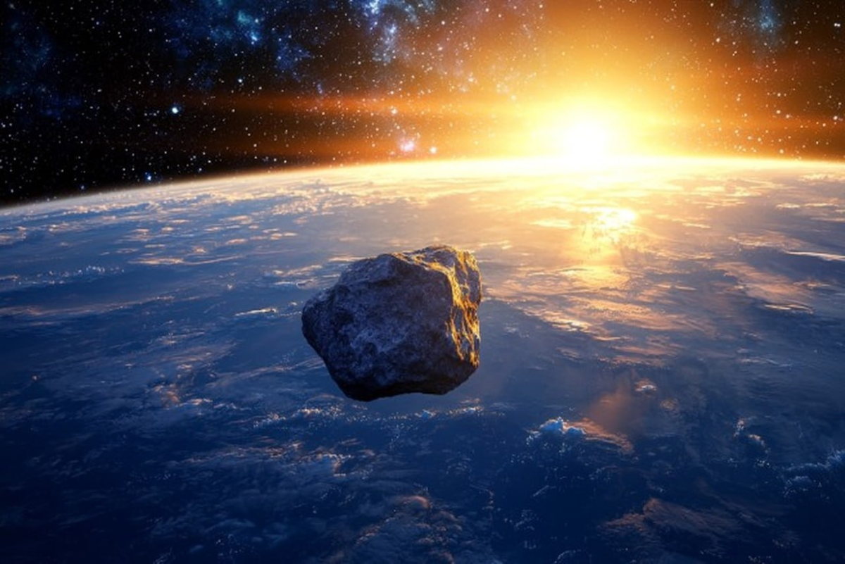 Астероид пролетающий рядом с Землёй в представлении художника.