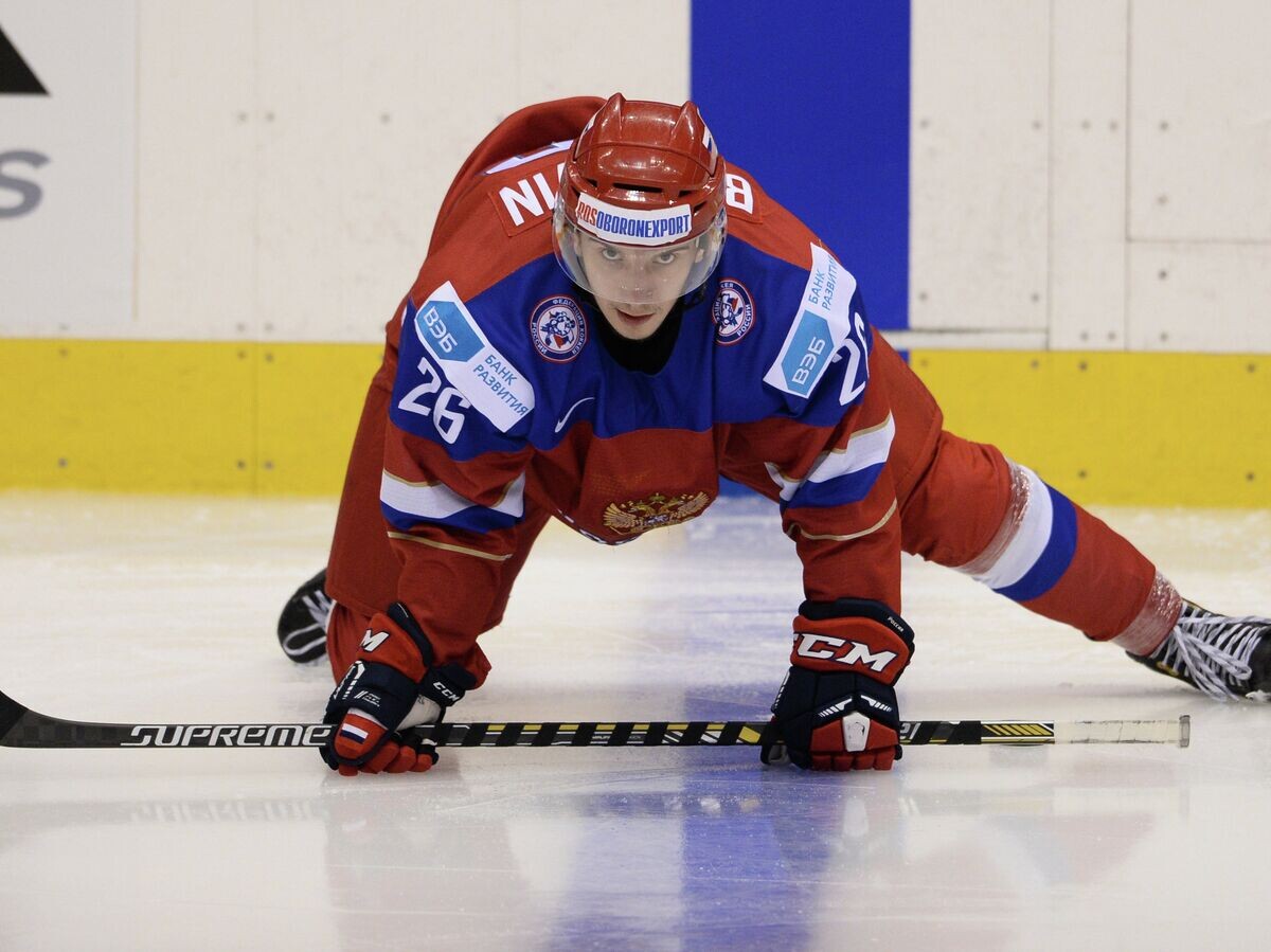   Хоккеист Владимир Брюквин© РИА Новости / Константин Чалабов