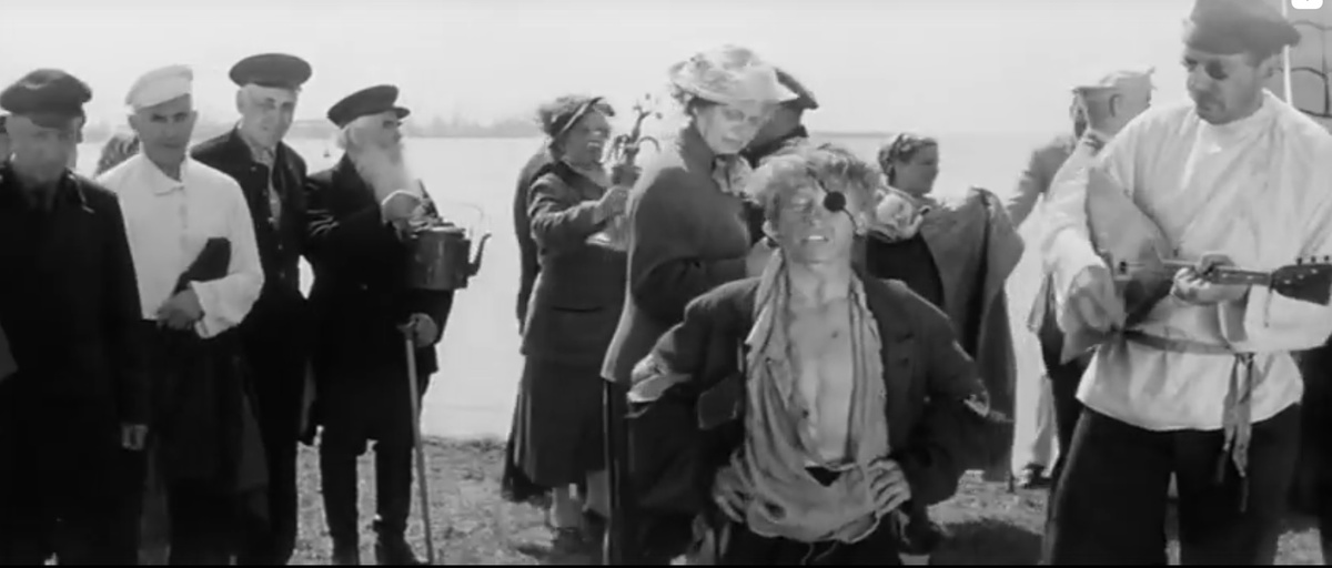 Скриншот автора. Базарный певец из кинофильма "Республика ШКИД".