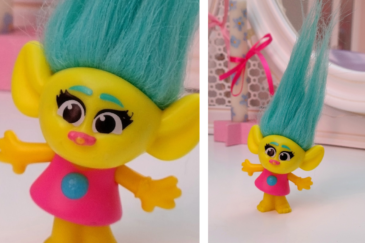 Это Смидж из какого-то мультика про троллей, а сама фигурка, как выяснилось позже, ещё и из времён Макдональдса.