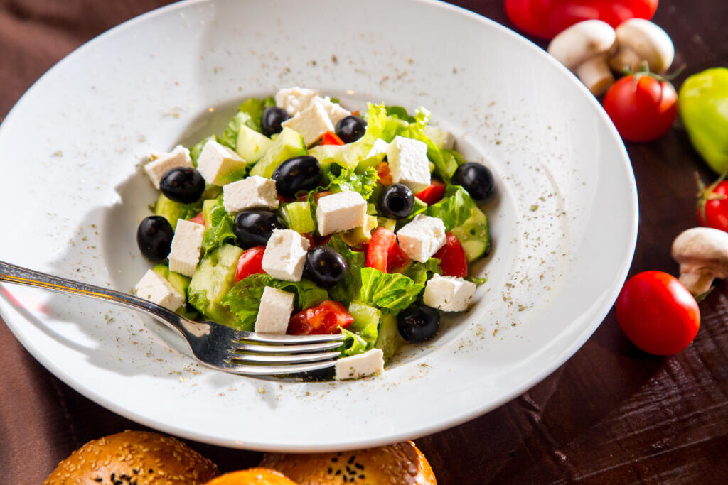    top view greek salad with black olives bread and mushrooms Журналист