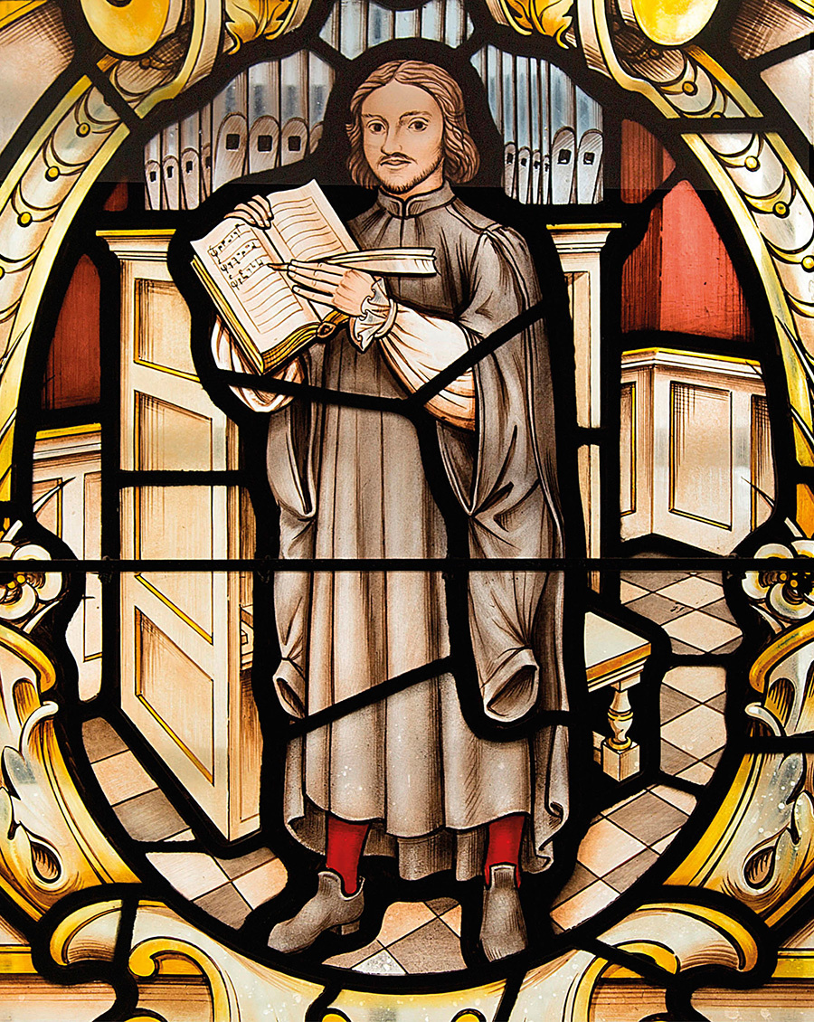 Таллис, выдающийся композитор английской хоровой музыки XVI века, сотрудничал как с католиками, так и с протестантами во время Реформации. Будучи членом Королевской капеллы, он писал музыку, которая отвечала меняющимся духовным потребностям королевской семьи. Здесь Таллис изображён на витраже церкви Святого Альфеге в Гринвиче, Лондон.