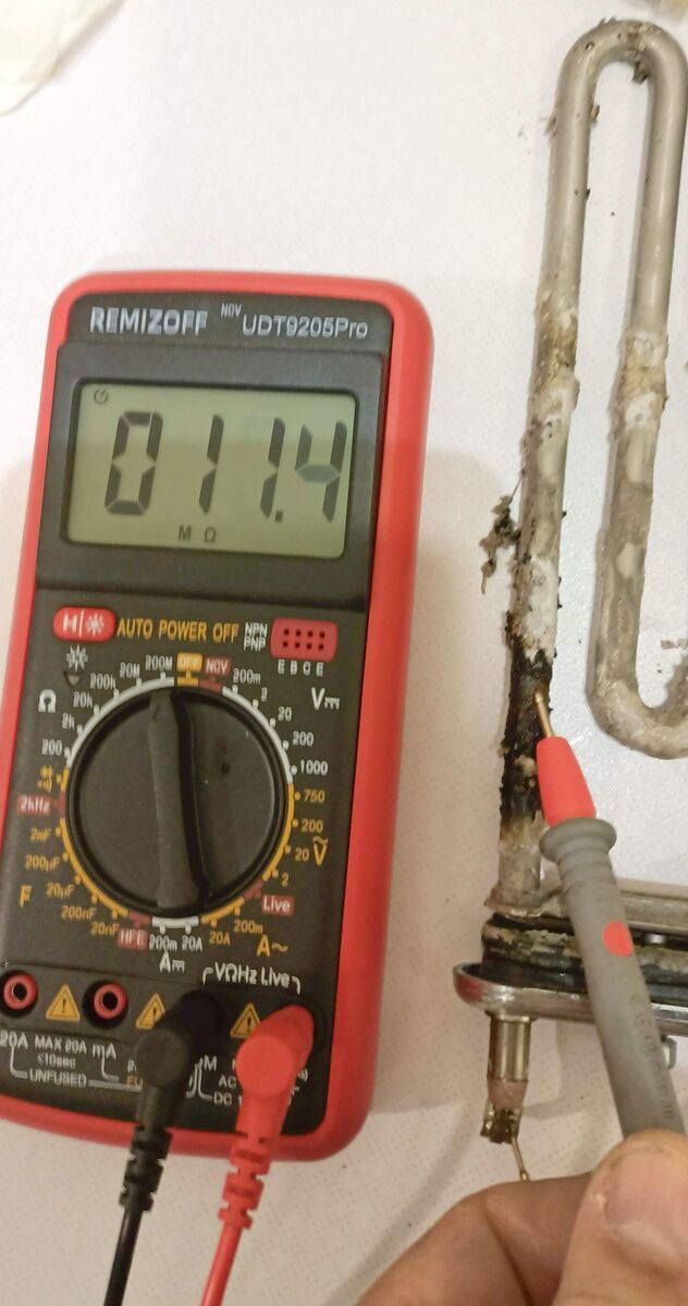 Прогоревший ТЭН - изоляция пробивается