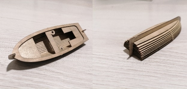 Это и есть шлюпки из набора. Там таких 3 штуки. Наверное, даже очень творческая обшивка рейками их не спасет.