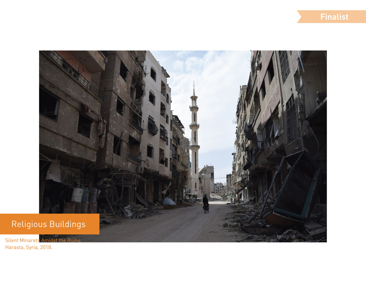 Мунеб Таим (Сирия)  Безмолвные минареты среди руин.
Хараста, Сирия, 2018 год.  Мунеб Таим - независимый фотожурналист и визуальный рассказчик, родился в 2001 году в Дамаске, Сирия. Он получил международное признание за свои яркие репортажи о социальных и гуманитарных проблемах, включая войну в Сирии, кризисы с беженцами и миграционные истории в Турции и Европе. Он показал борьбу, стойкость и человечность людей, оказавшихся в кризисной ситуации, через призму личного опыта,
предлагая редкий взгляд изнутри. Его изображения стали визуальными ориентирами для многих ведущих международных и голландских СМИ. В настоящее время Мунеб живет в Европе и выставляет свои работает по всему миру и был удостоен фотопремии Винсента ван Гога, номинирован на "Золотую камеру" и назван лучшим фотографом Нидерландов. Он продолжает создавать захватывающие визуальные сюжеты, которые способствуют осознанию и сопереживанию                                                                                                                                 Muneb Taim (Syria) Silent minarets among the ruins.
Harasta, Syria, 2018.  Muneb Taim is an independent photojournalist and visual storyteller, born in 2001 in Damascus, Syria. He has gained international recognition for his vivid reporting on social and humanitarian issues, including the war in Syria, refugee crises, and migration stories in Turkey and Europe. He showed the struggle, resilience and humanity of people in crisis situations through the prism of personal experience.,
offering a rare inside look. His images have become visual reference points for many leading international and Dutch media outlets. Currently, Muneb lives in Europe and exhibits his work all over the world and was awarded the Vincent van Gogh Photo Award, nominated for the Golden Camera and named the best photographer of the Netherlands. He continues to create exciting visual stories that promote awareness and empathy.