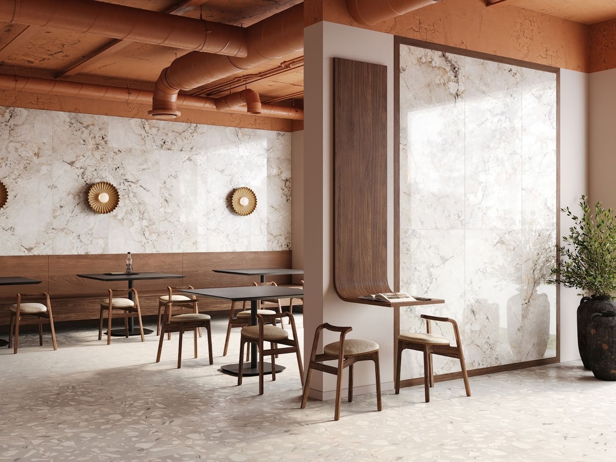 На стенах — полированный крупноформатный керамогранит MOGXL3003. На полу — керамогранит Arti с рисунком терраццо. Источник: Estima