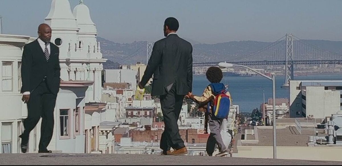 А это настоящий Крис Гарднер, который на время появляется в концовке кинокартины "Погоня за успехом"