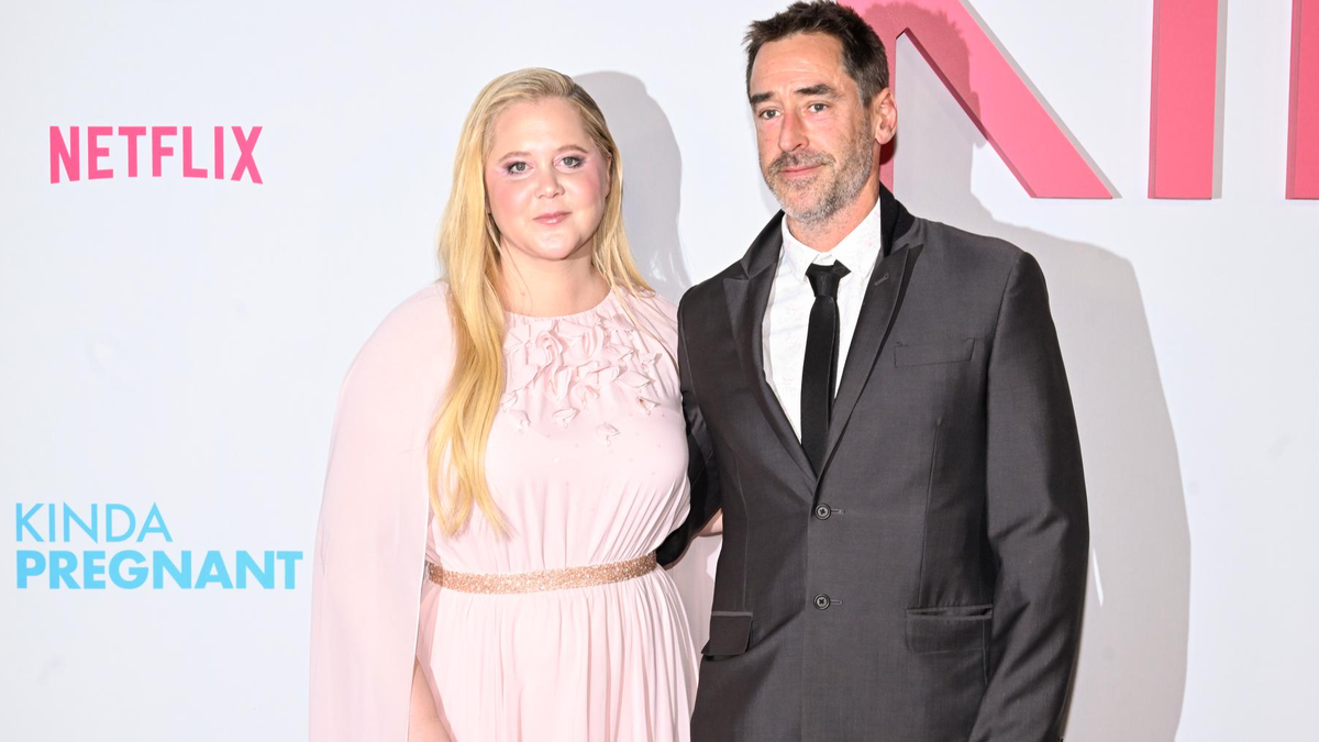    Эми Шумер с мужем — Крисом Фишером. Фото: Getty Images