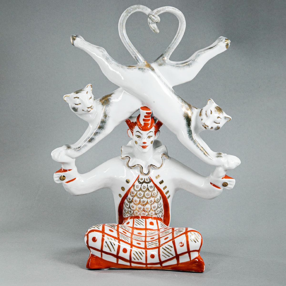 Статуэтка "Новый аттракцион", сюита "Цирк". А. Бржезицкая. СССР, Дулево, кон. 1960-х - 1970-е гг. Фарфор, роспись.Фарфор, полихромная роспись, золочение. Высота: 35,5 см. Длина: 26,5 см. bidspirit.com