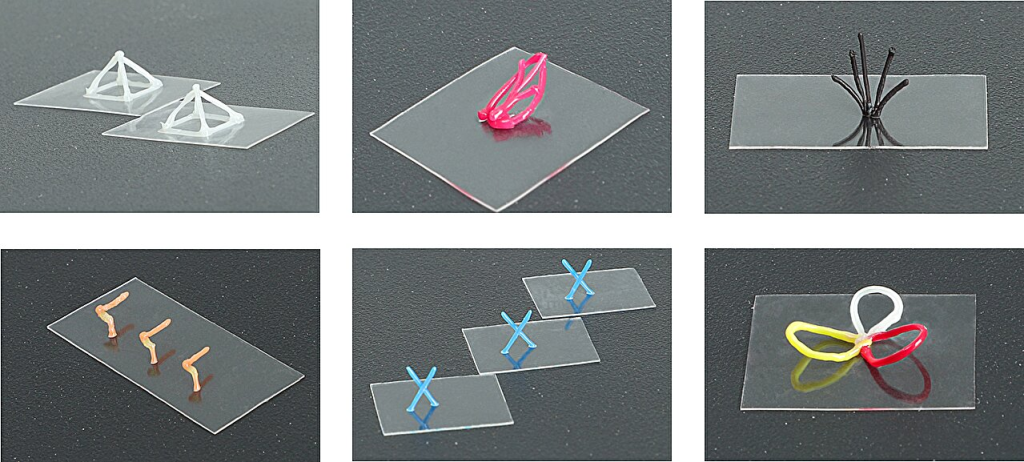 Оптические изображения отдельно стоящих трёхмерных структур с различными термосетами. Материалы (слева направо, сверху вниз): PDMS; PDMS с красным пигментом; PDMS с чёрным пигментом; Кожа дракона с оранжевым пигментом; Ecoflex с синим пигментом; и PDMS с белыми, жёлтыми и красными пигментами. Фото: Переопубликовано с разрешения, Цибинь Чжуан и др.