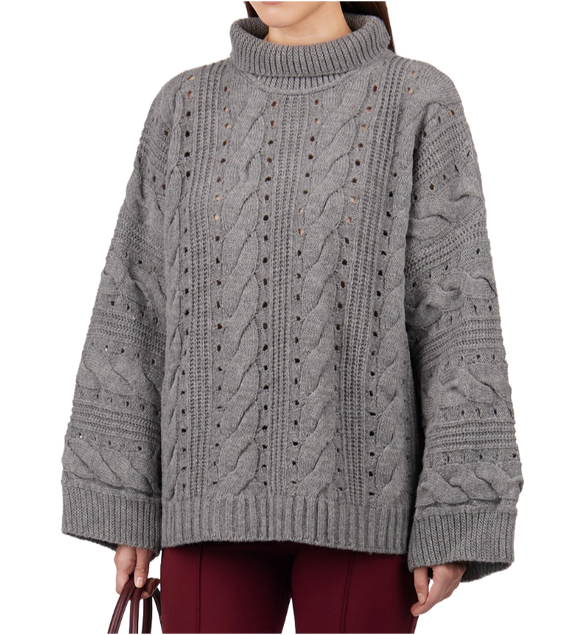 Свитер - в сером цвете.