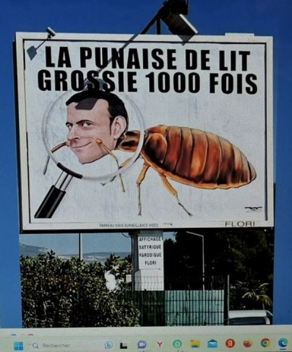 На рекламном щите надпись: "Постельный клоп, увеличенный в 1000 раз". 