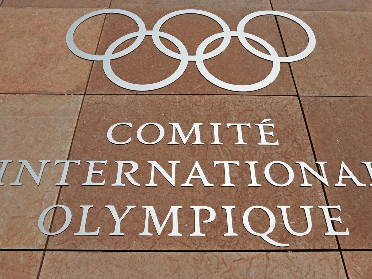    Олимпийский символ на здании штаб-квартиры Международного олимпийского комитета в Лозанне | © РИА Новости / Антон Денисов