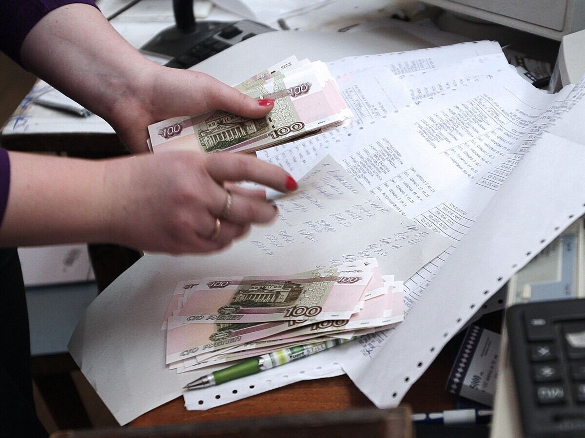    Выдача денег© РИА Новости . Тарас Литвиненко