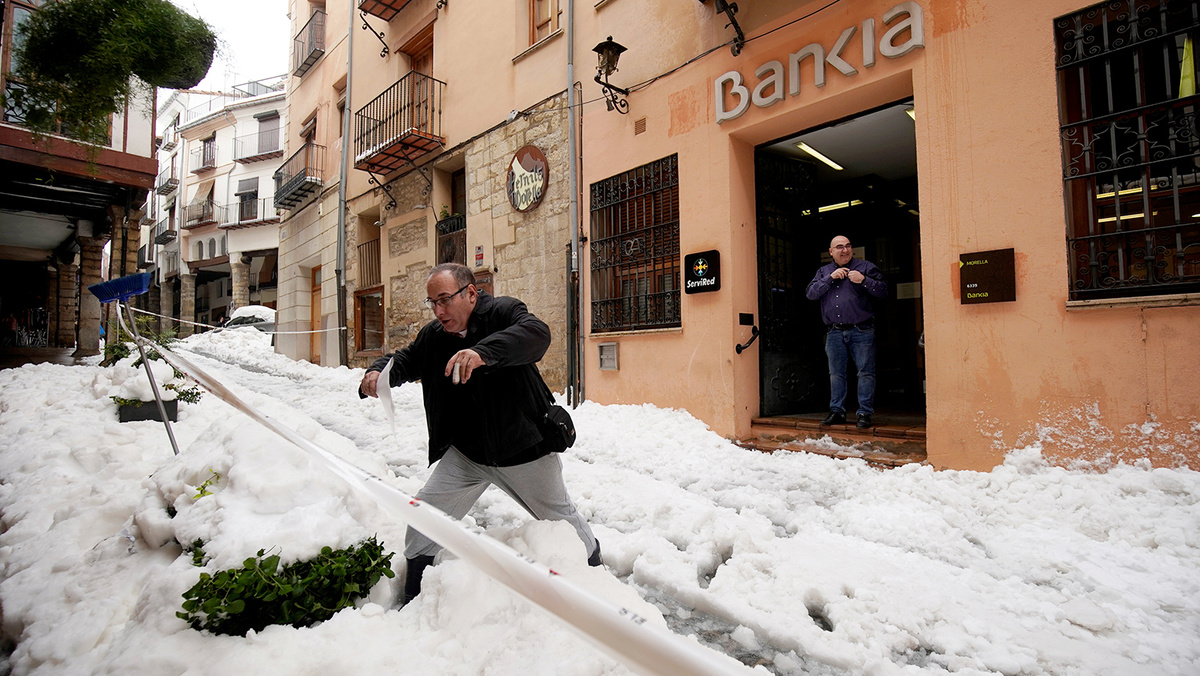    A man walks during the storm "Gloria" in Morella, Spain, January 22, 2020. REUTERS/Juan Medina