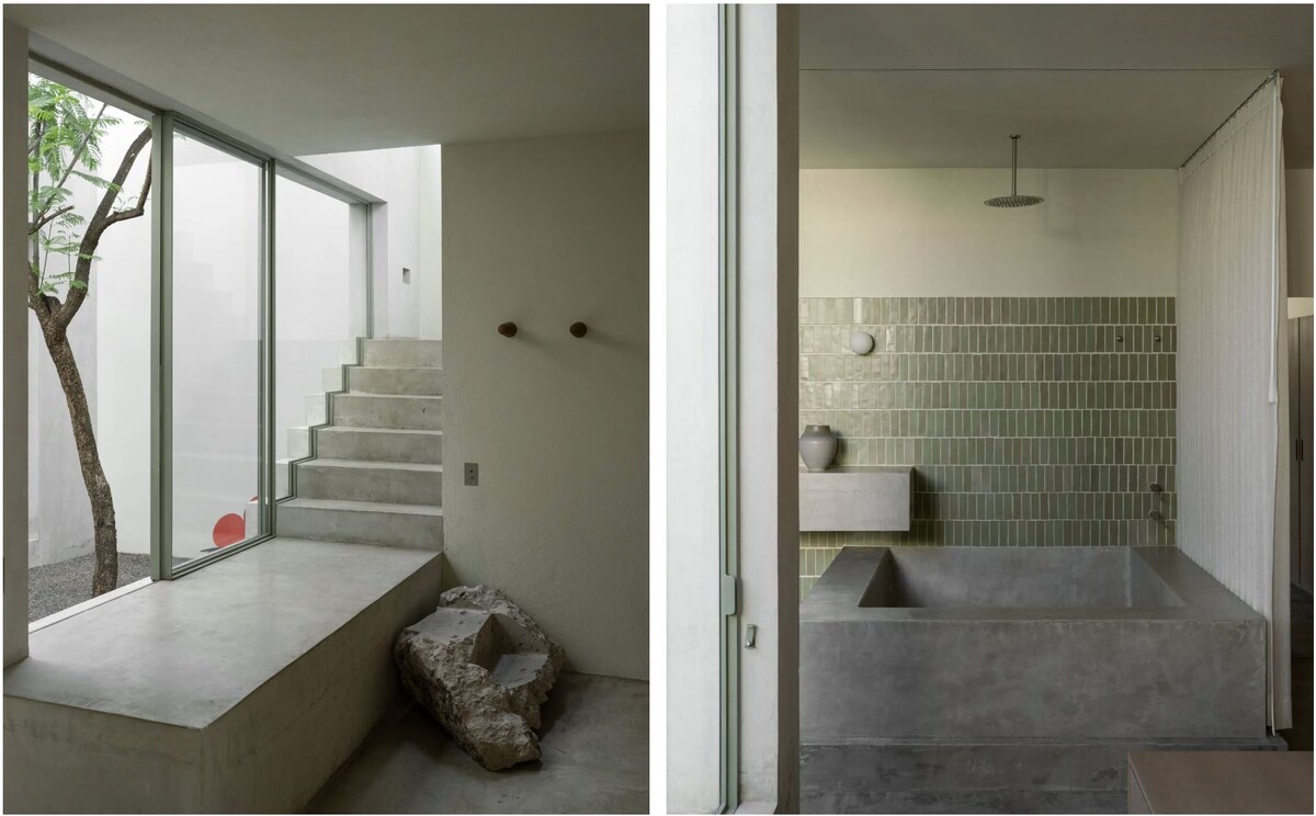 Широкая бетонная лестница на второй этаж. Просторная ванная комната с бетонной столешницей 2,5 метра, облицованная серо-зеленой плиткой Lofa
