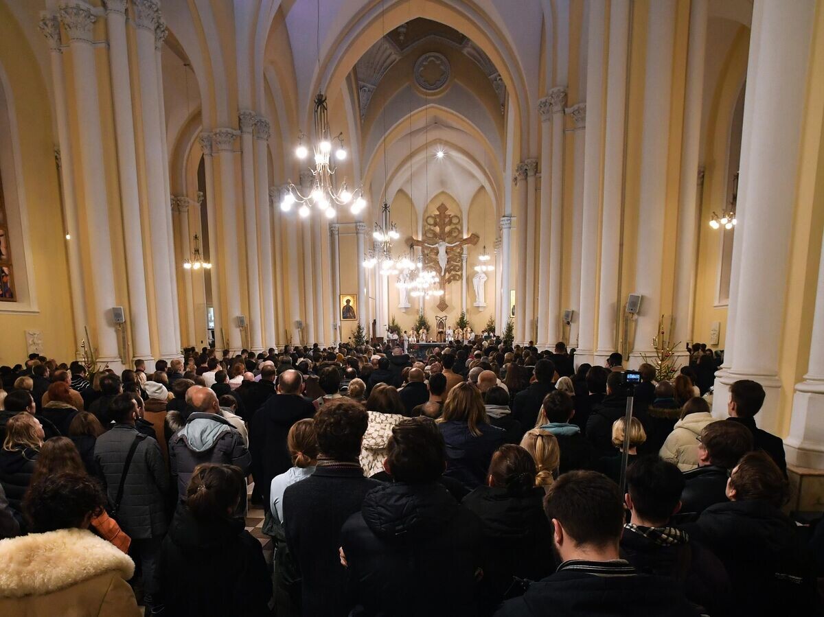    Прихожане на Рождественском богослужении в римско-католическом кафедральном соборе Непорочного Зачатия Пресвятой Девы Марии в Москве | © РИА Новости / Михаил Воскресенский