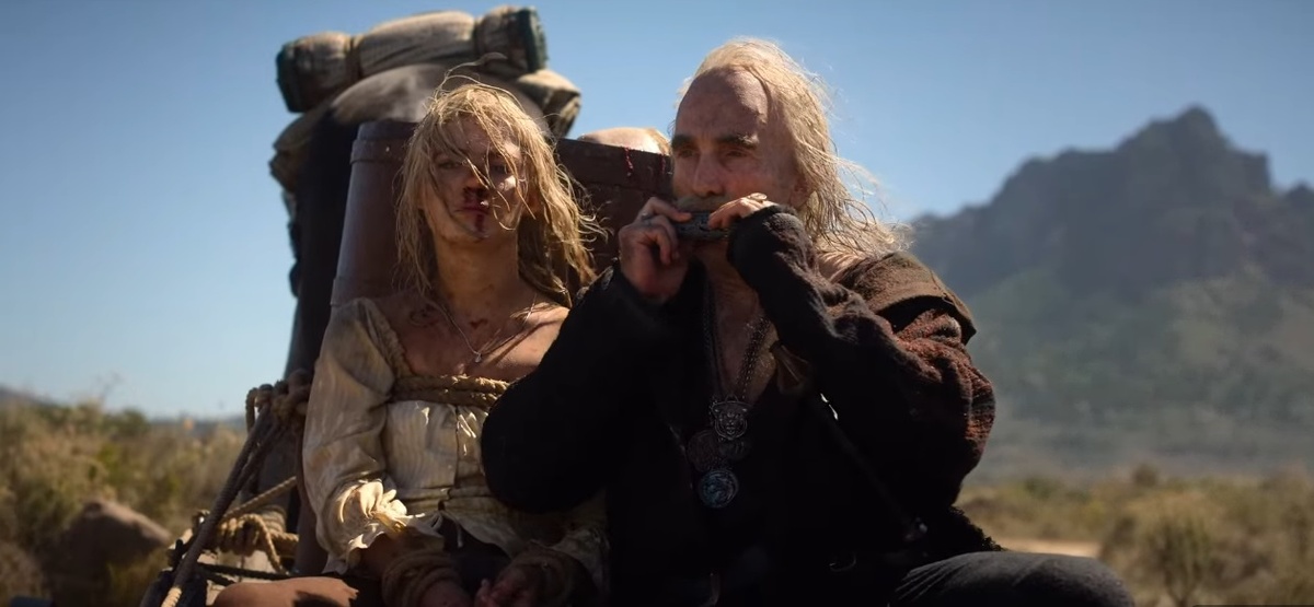 Лео развлекает Цири игрой на губной гармошке. 