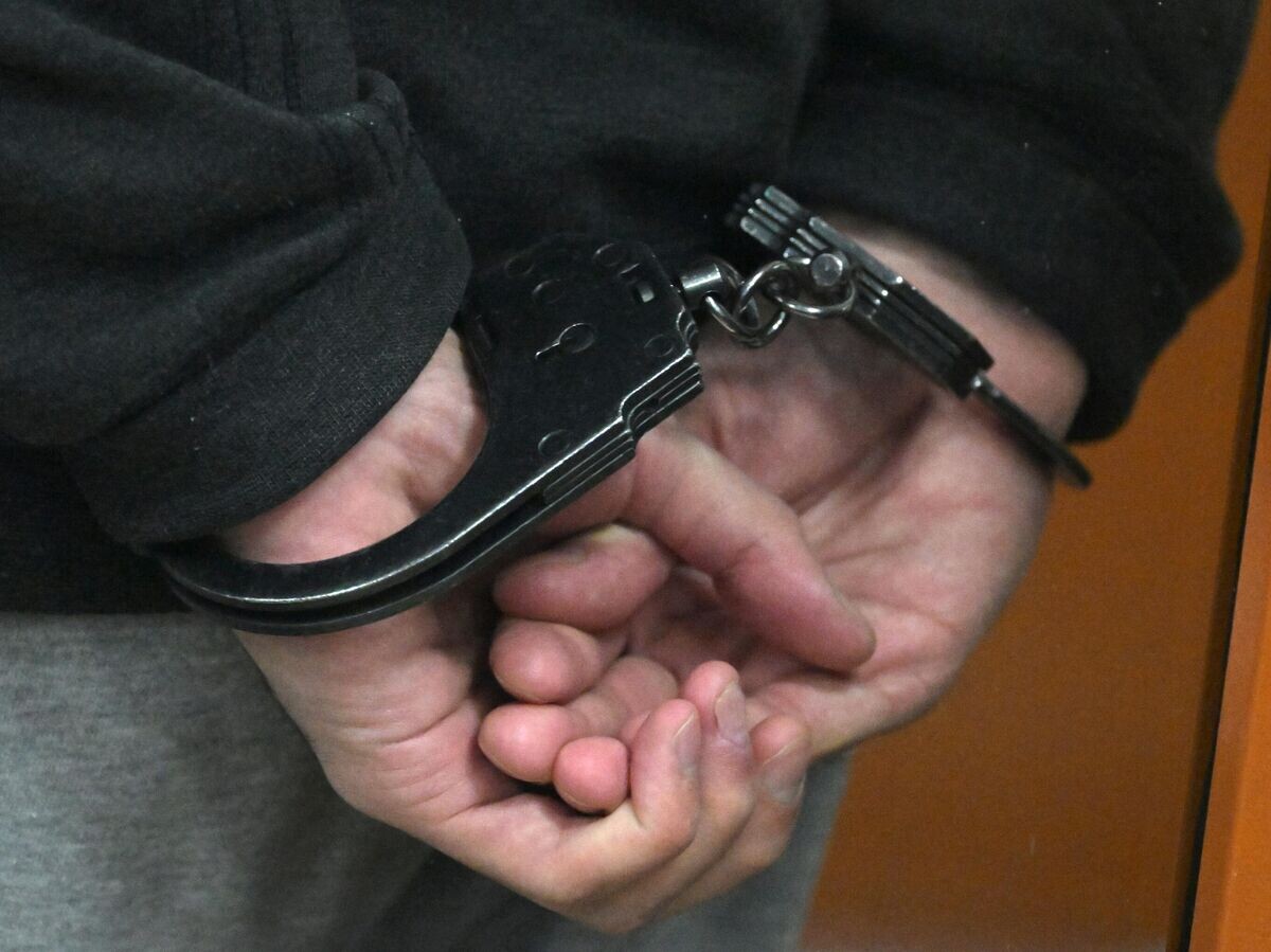    Наручники на руках | © РИА Новости / Евгений Биятов