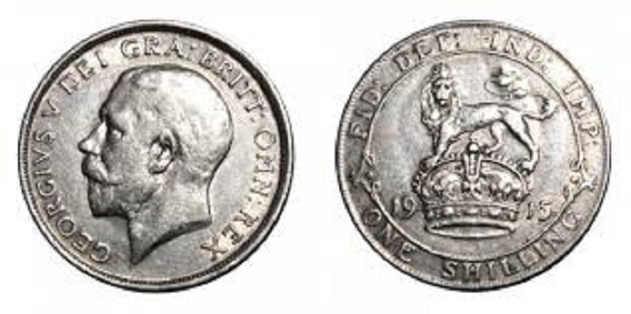 Шиллинг 1915 года был изготовлен из серебра 925 пробы (50% серебра). Эта серебряная монета стоила 1/20 фунта стерлингов. В военное время на нее можно было купить 2-4 буханки хлеба или несколько пинт пива. А еще за него бедолаге "томми" могут отстрелить башку - см. выше.