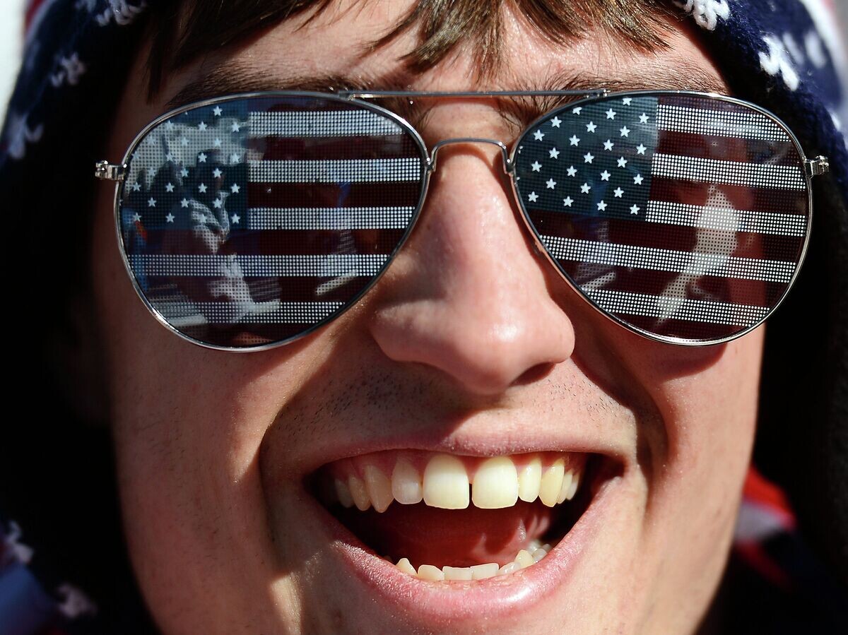    Американский болельщик во время финала слоупстайла на соревнованиях по сноуборду | © РИА Новости / Рамиль Ситдиков