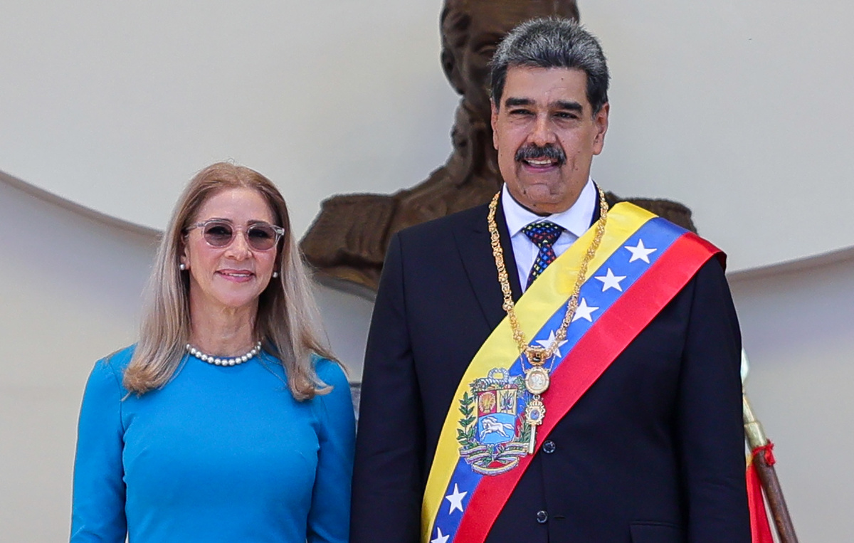    Президент Венесуэлы Николас Мадуро (справа) и Силия Флорес   Jesus Vargas/Getty Images