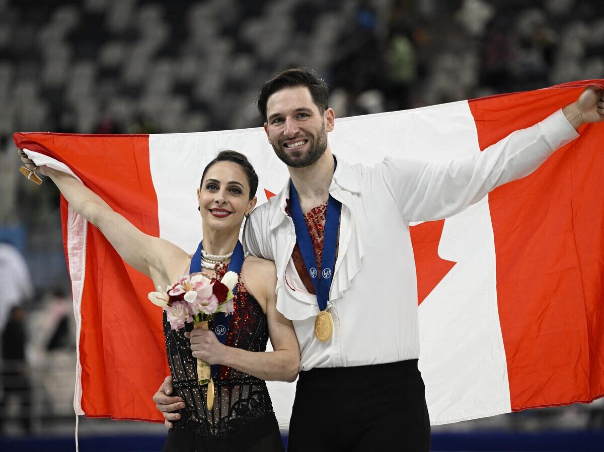    Канадские фигуристы Деанна Стеллато-Дудек и Максим Дешам | © AP Photo / GREG BAKER