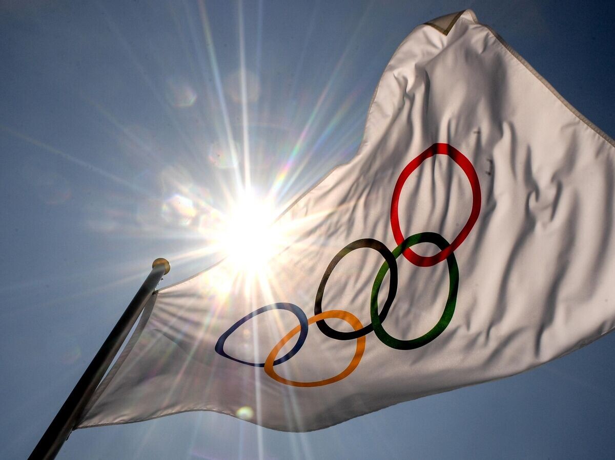    Флаг с символикой Олимпийских игр в Токио | © РИА Новости / Алексей Филиппов