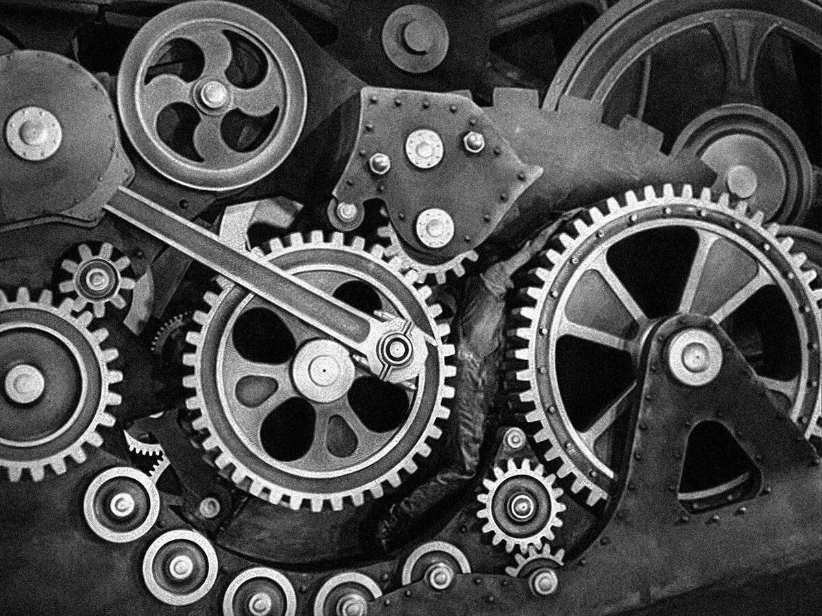 Кадр из фильма «Новые времена» (реж. Чарли Чаплин, 1936)
Тело рабочего инкорпорировано в машину