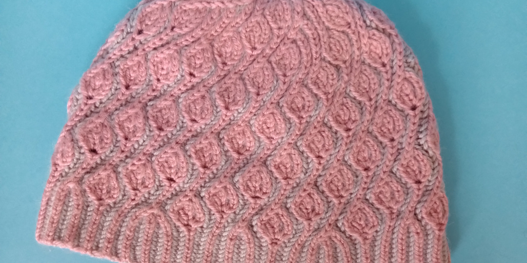 Воздушные двухцветные узоры Бриошь спицами