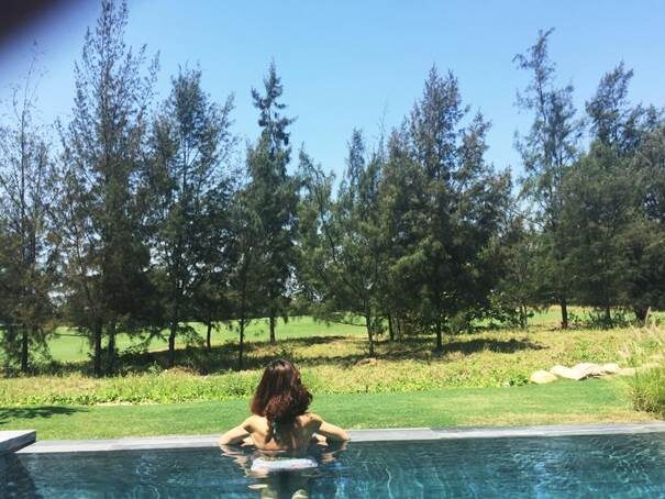 Guests relaxing by the private pool