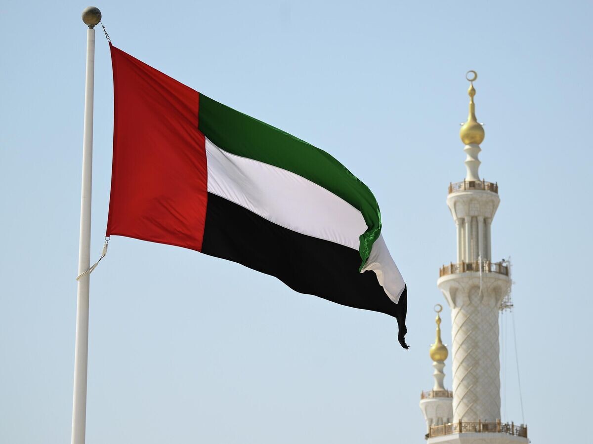    Флаг ОАЭ в Абу-Даби | © РИА Новости / Кирилл Зыков