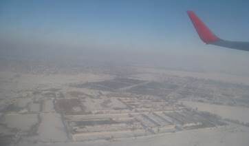 Под крылом заснеженная Украина.