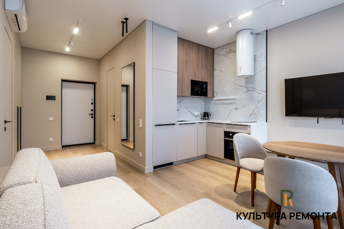 Кухня-гостиная в однокомнатной квартире после ремонта в ЖК Дельвиг