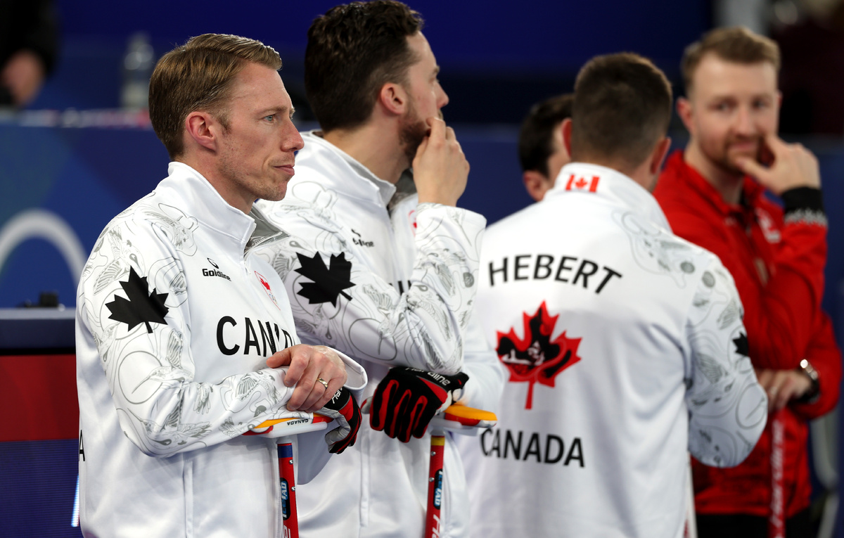    Керлингисты сборной Канады  Al Bello/Getty Images