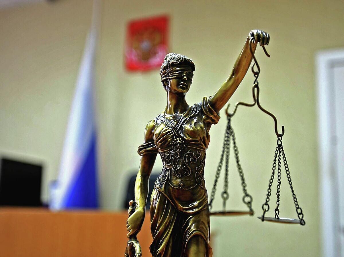    Статуэтка богини правосудия Фемиды в зале суда.© РИА Новости . Павел Комаров