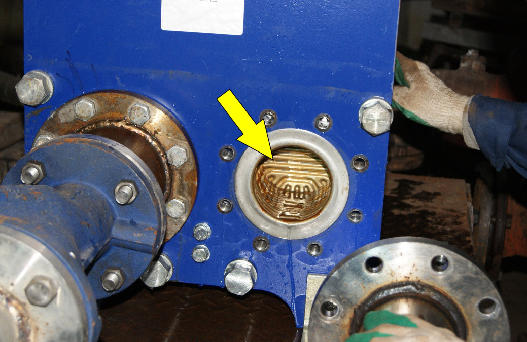 Пластины теплообменника через 3 месяца работы ферритного противонакипного устройства. Как новые!