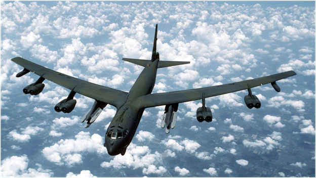 Американский стратегический бомбардировщик компании "Боинг" В-52 "Стратофортресс", модификация "Джей”: максимальный взлетный вес — 221350 кг, максимальная скорость - 957 км/ч, силовая установка — 8 двигателей Джи57П -43ВБ тягой по 6240 кг, потолок практический — 16 765 м, дальность полета без дозаправки — 12 070 ш; вооружение: 39 ракет АГМ-69, обычные и ядерные бомбы или 12 ракет АГМ-В6 на наружной подвеске и 20 ракет АГМ-69 в бомбоотсеке, четыре 12,7-мм пулемета; длина — 49,05 м, размах крыла - 56,39 м. площадь крыла — 371,6 кв. м, высота - 12,4 м, экипаж — 6 человек. Первый полёт 15 апреля 1952г. Начало эксплуатации – февраль 1955г. С 1952 по 1962 годы выпущено 744 бомбардировщика.