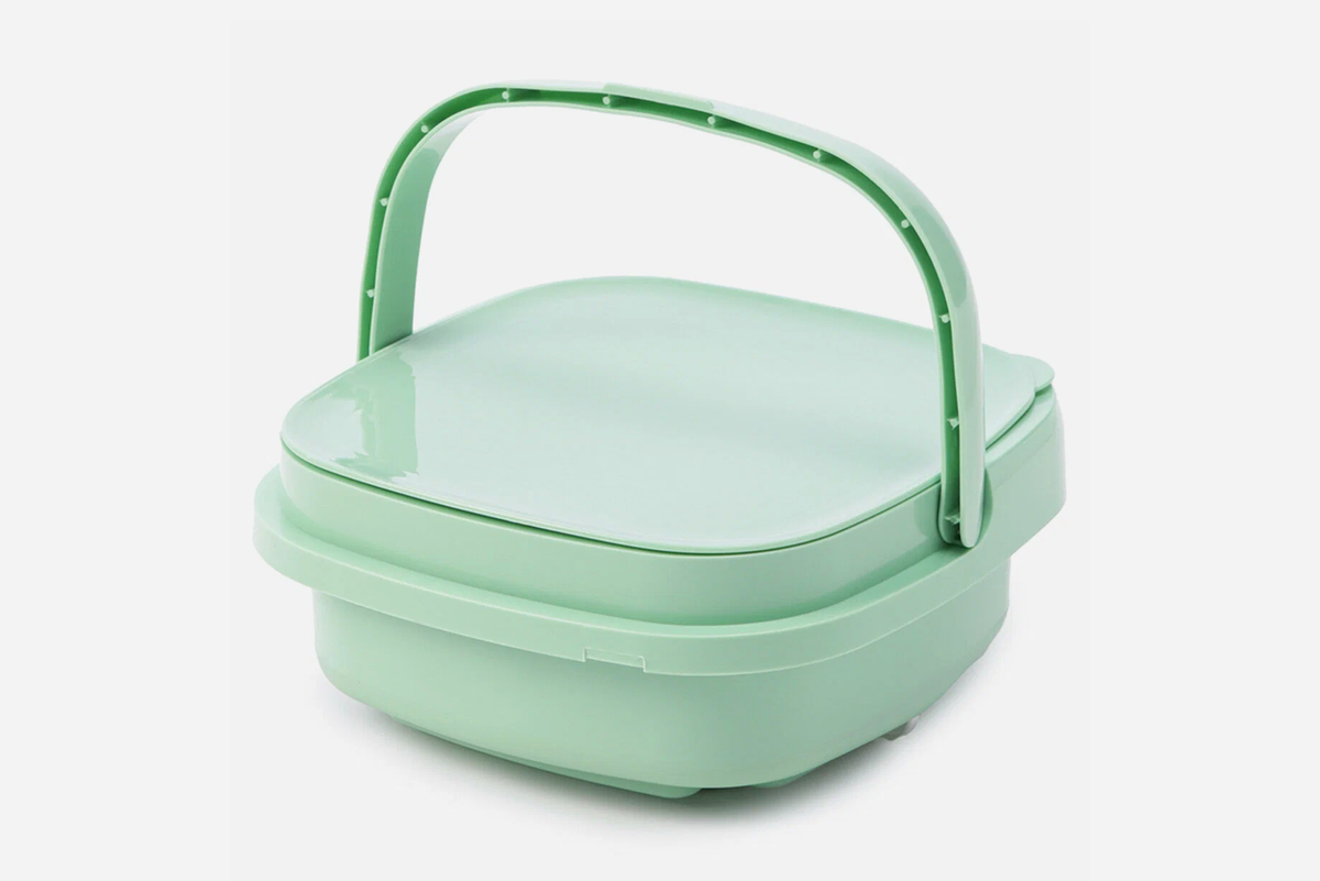 Портативную стиральную машину удобно переносить за ручку. Фото: Яндекс Маркет