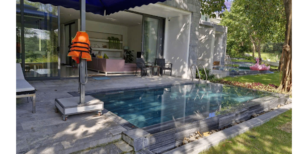 Shaded Outdoor Lounge Area by Pool