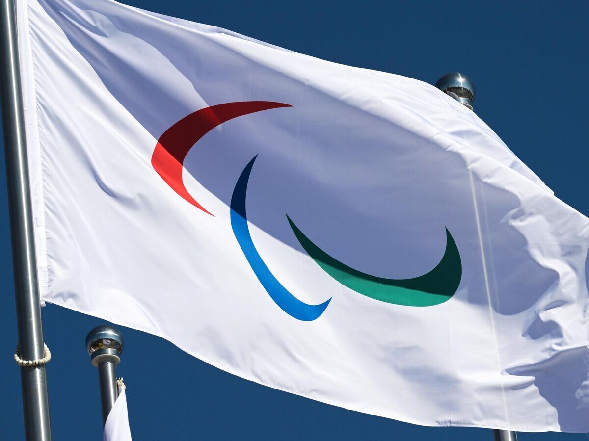    Флаг Паралимпийского движения в Олимпийской деревне в Пекине | © РИА Новости / Григорий Сысоев