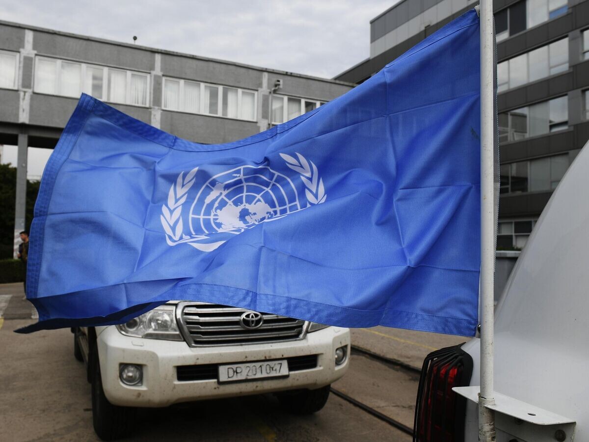    Флаг ООН на автомобиле с делегатами Международного агентства по атомной энергии (МАГАТЭ) на территории Запорожской атомной электростанции | © РИА Новости / Константин Михальчевский